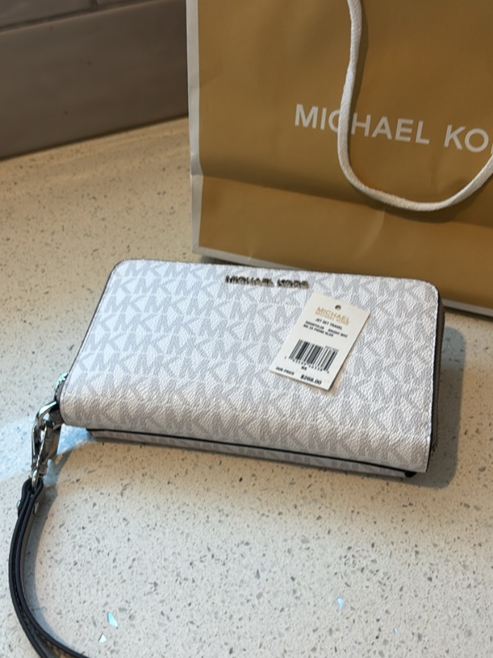 Very lightly used. Michael Kors Jet Set Travel with phone case